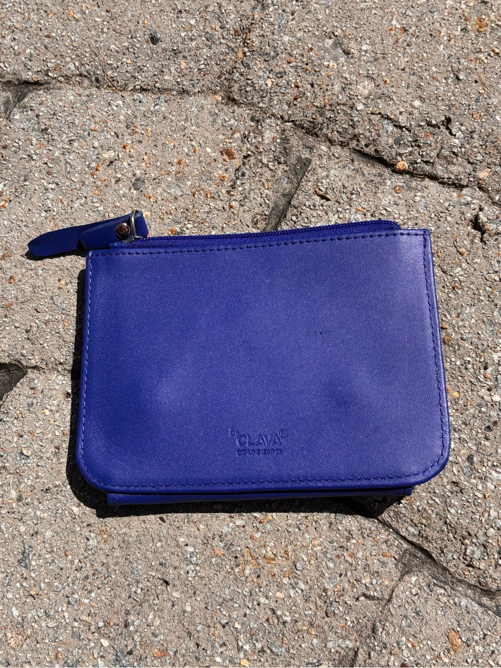 Bright royal blue genuine leather bifold wallet by Clava. Top zipper closure